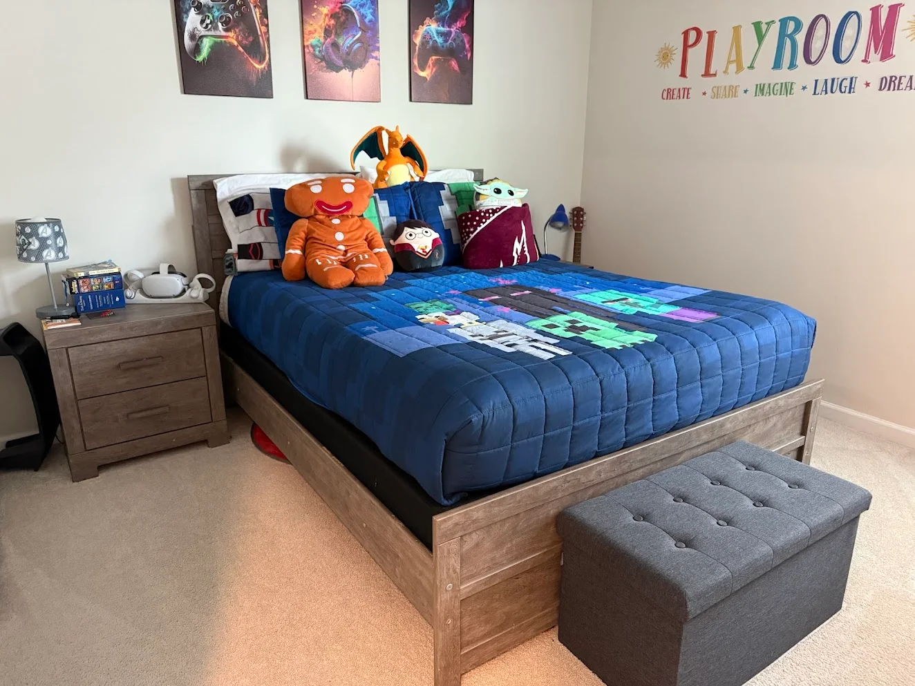 A tidy child’s bedroom with a made bed, blue bedding and stuffed toys